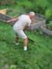 mowing lawn with a scythe